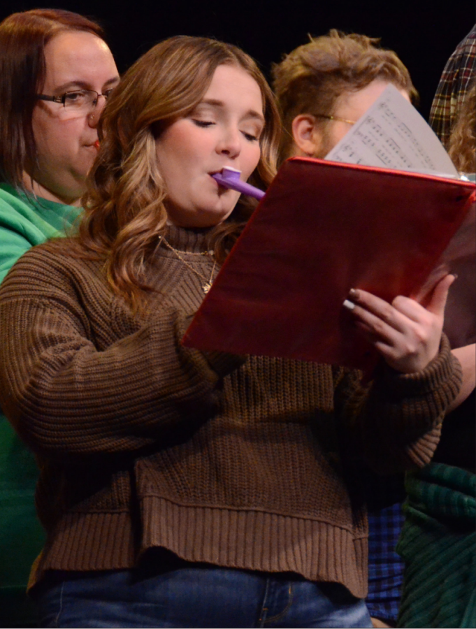 Senior Molly Lewis playing the kazoo as the choir sings “Don’t be a Jerk! It’s Christmas.”