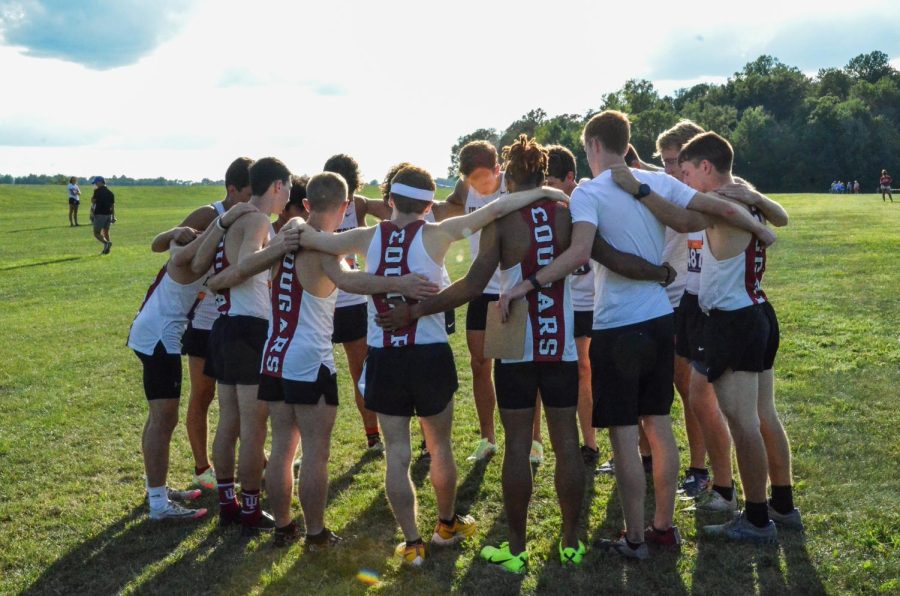 The Indiana University Kokomo men’s team huddles before the start of the 5,000-meter race at the Cougar Classic meet on Aug. 26. The men’s team went on to place third overall in the meet.
