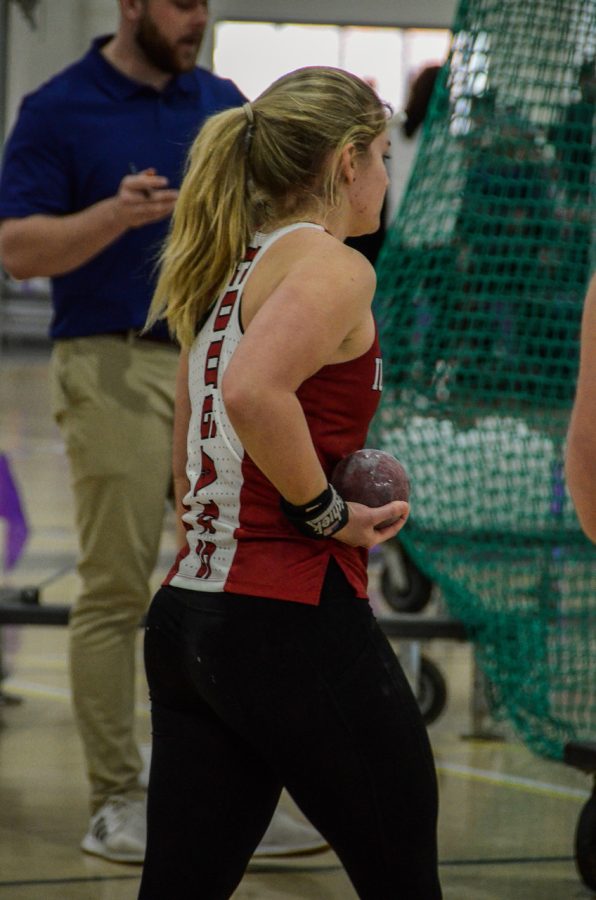 Junior Emma Byrum prepares for the womens Shot Put event at Taylor University on Jan. 28. Byrum went on to place 2nd with a throw of 12.05m, breaking the school record.