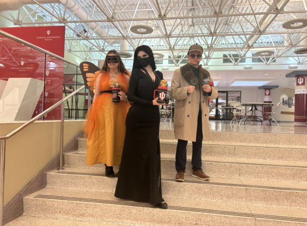 Winners of the costume contest. Julienne Carlile in monarch butterfly costume (left). Cyrus Felger in Sherlock Holmes costume (right). Myah Halter as Morticia from the Adams Family (center) 
